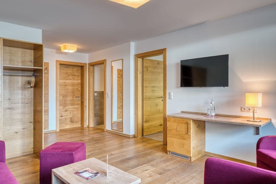 Design Suite, 1 Bedroom | Living area | 50-inch flat-screen TV with cable channels, TV