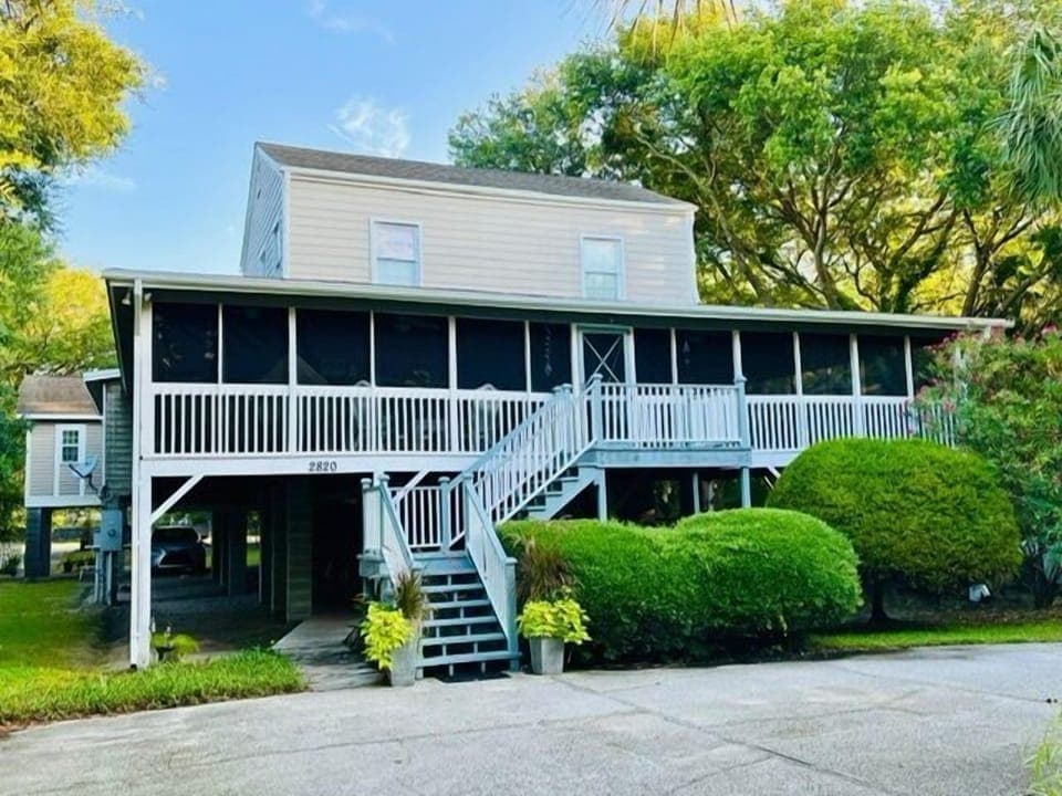 Full front of house with parking