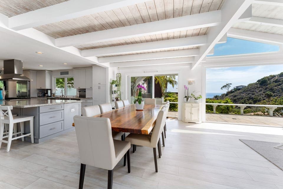 Solid wood live edge dining table for 10 with ocean views