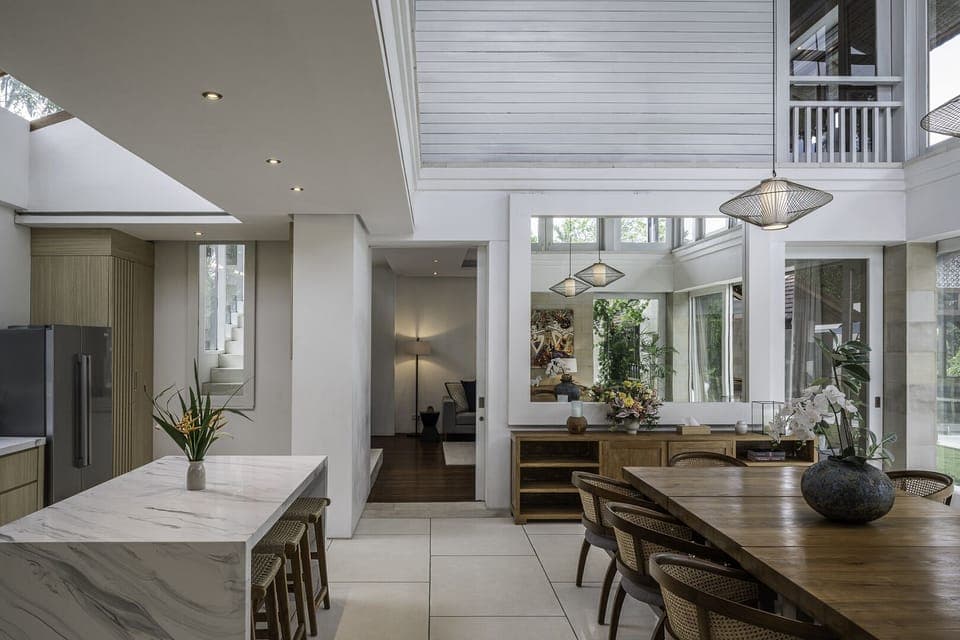 Dining room and kitchen connected to the living room all under one roof