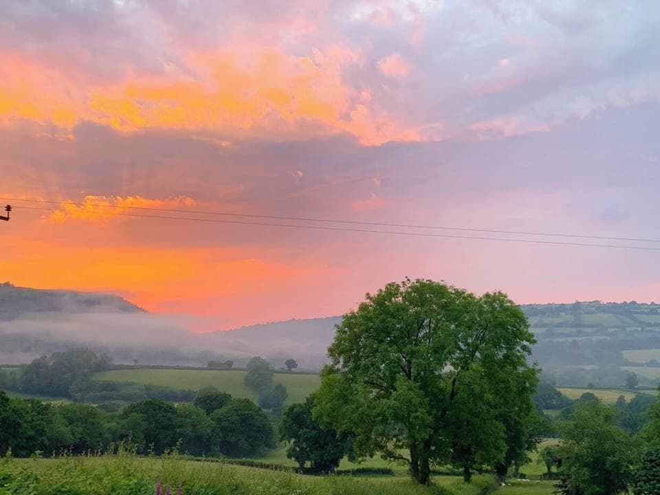 Watch the sun setting as you relax in the garden | Dairy Cottage - Carmarthen Cottages, Cwmdu, Near Llandeilo