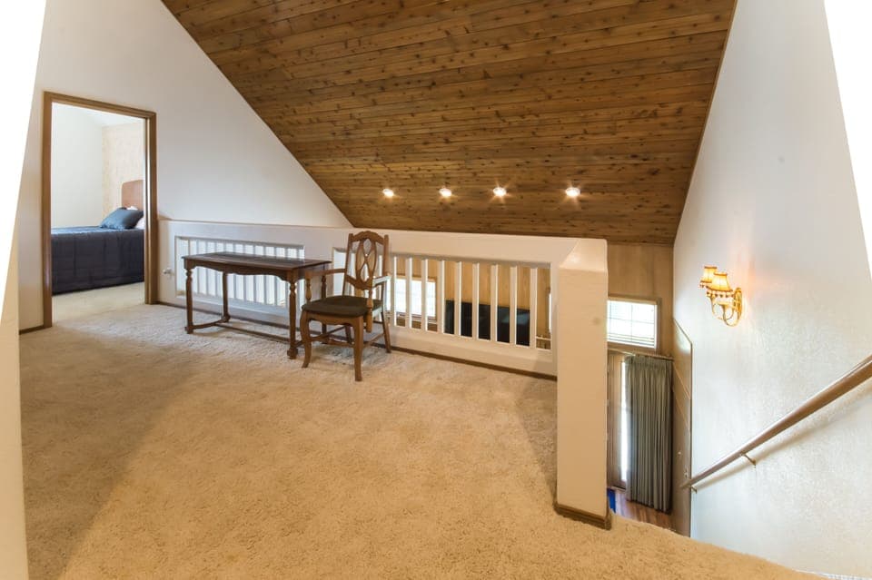 Loft area in between upstairs rooms. Lots of privacy in this spacious house!