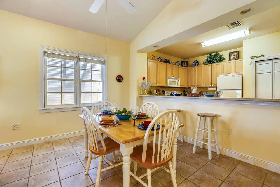 Indoor dining area and breakfast bar in the kitchen.