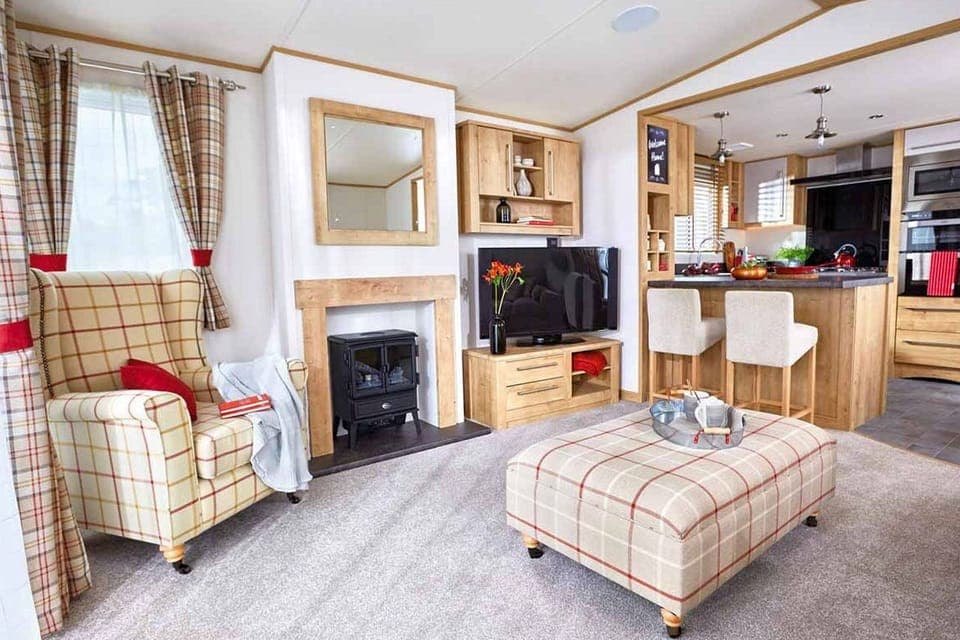 Indulgent 8 Berth Caravan with Hot Tub Pet Free | Living area | Flat-screen TV