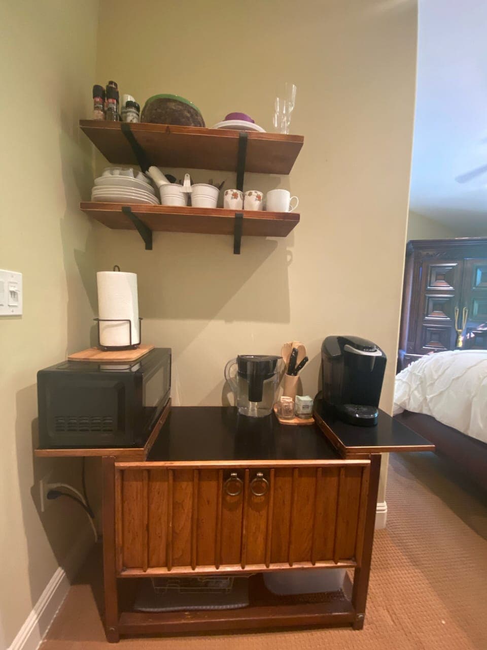 Kitchenette area has microwave and a Keurig