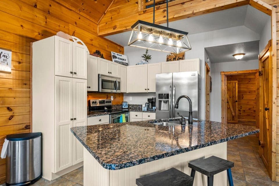 Full-sized kitchen with suite of stainless steel appliances.