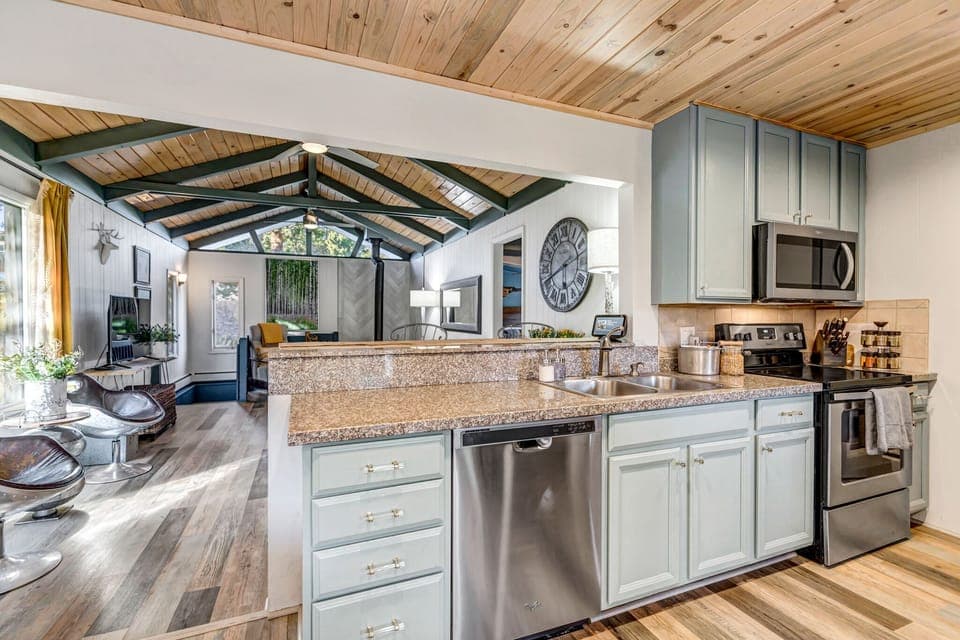 Gourmet Open Floor Kitchen: Our main floor kitchen opens up beautifully to the dining and living areas, creating a seamless space for gatherings and culinary delights. 