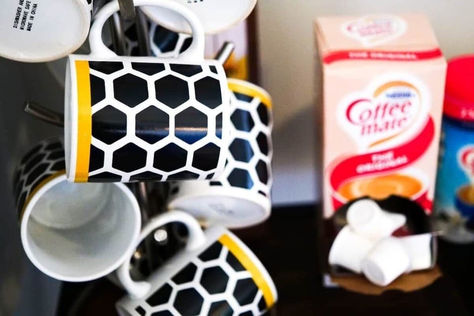 - Coffee and tea station fully stocked with sweeteners   - Guests enjoy convenient hot drinks with variety choices   - Complete with tea bags, sugars, and extra essentials  