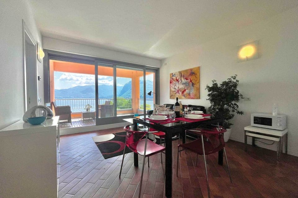 Open plan dining living room area with view of the lake