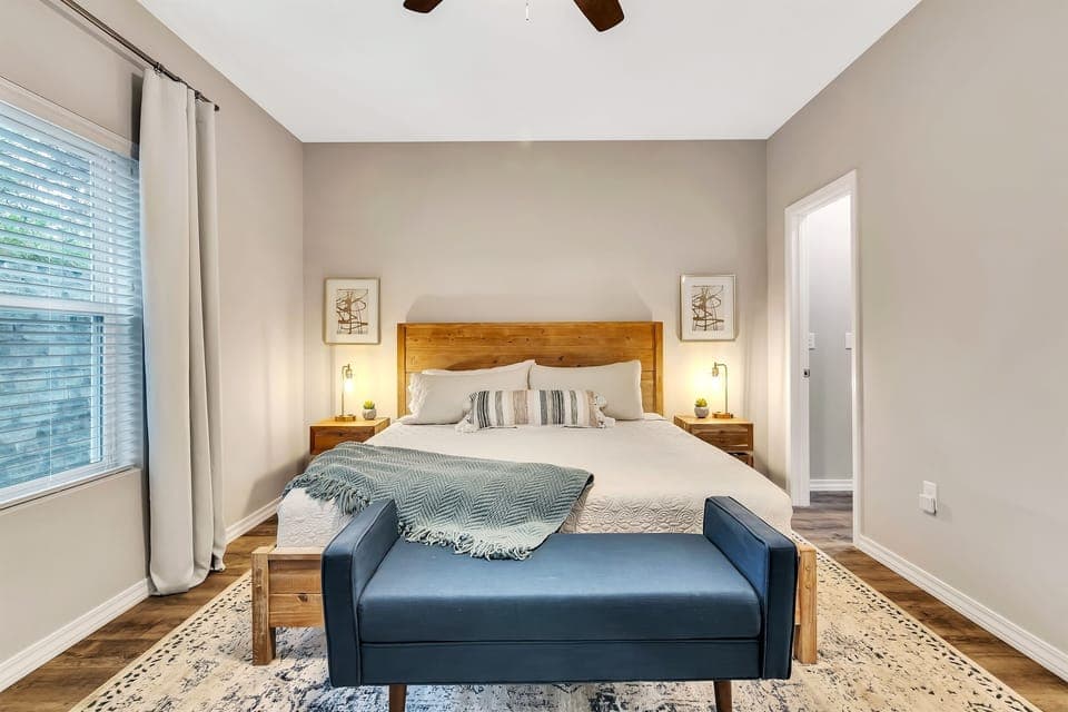 Bedroom #1 - Master King Bedroom with en-suite offers dual sinks, walk in shower, walk in closet, Smart TV and desk with high speed internet. Can also access deck from this bedroom.