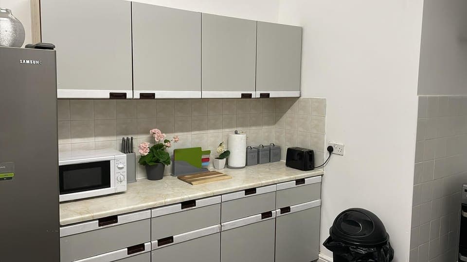 Mini-fridge, microwave, cookware/dishes/utensils