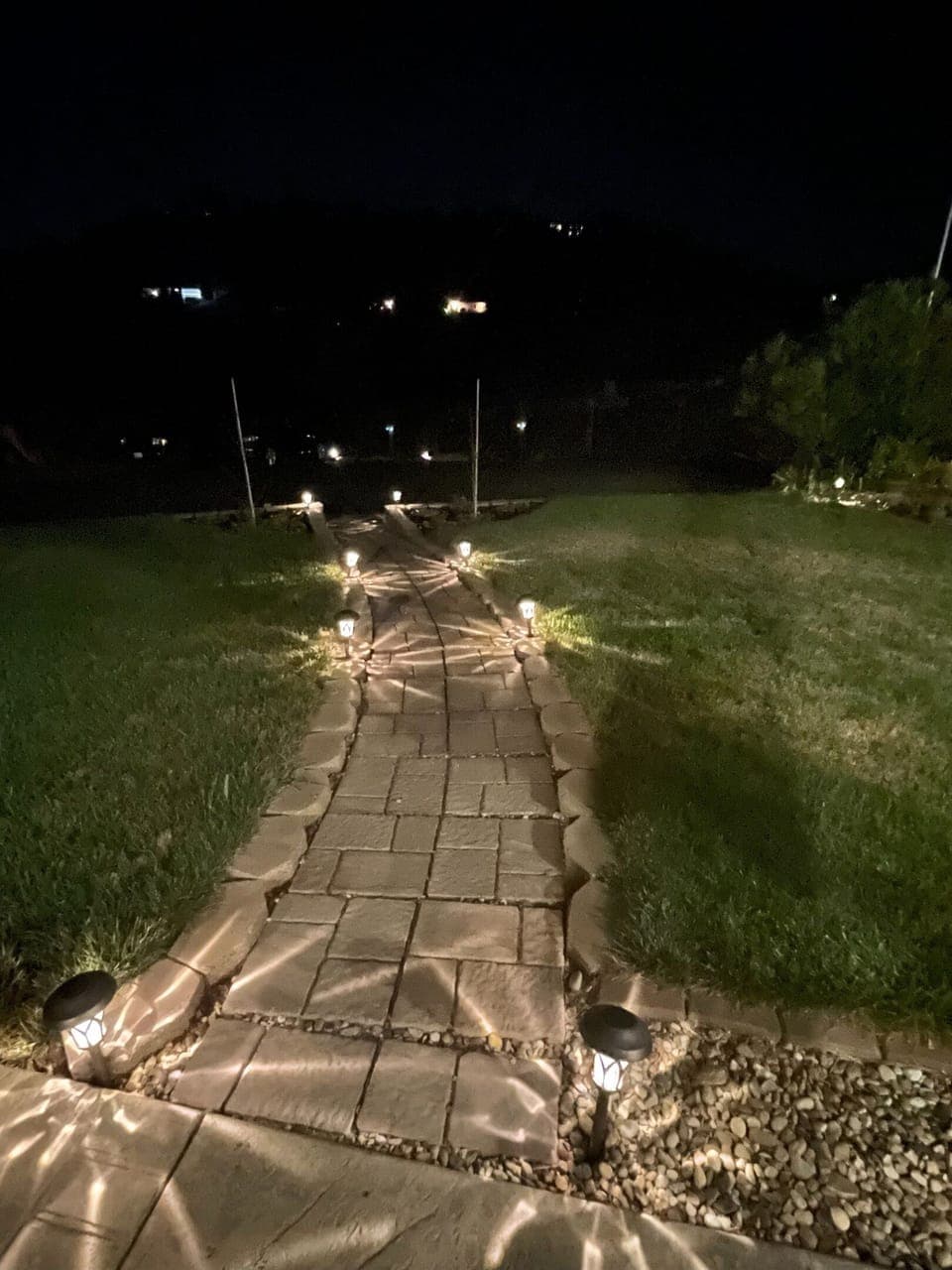 Pathway to entrance lit at night