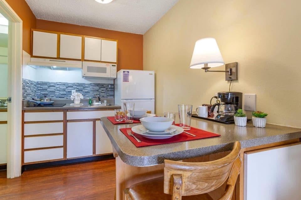 Desk, laptop workspace, blackout drapes, iron/ironing board