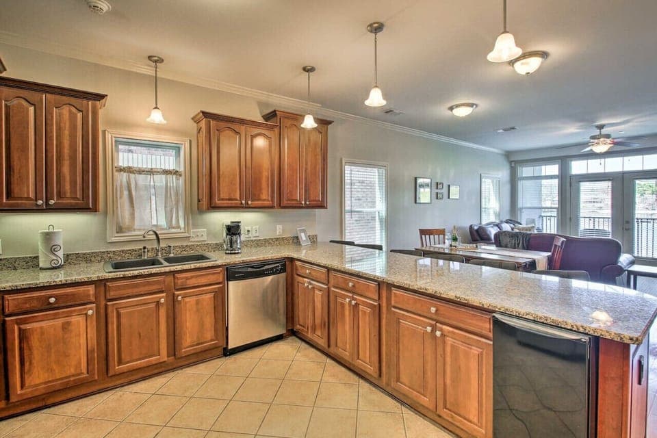 Spacious kitchen with granite countertops, bar seating, and plenty of room for cooking and entertaining.