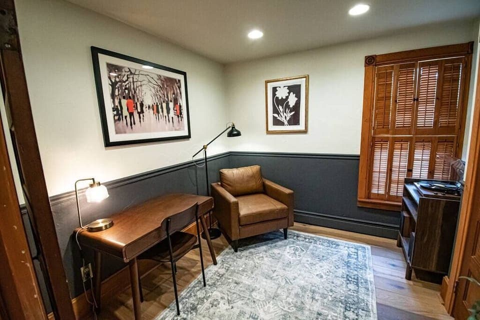 A peaceful music room offering a quiet workspace and flexible sleeping with a twin fold-out bed—ideal for work, rest, or creativity. 🎶🖥️