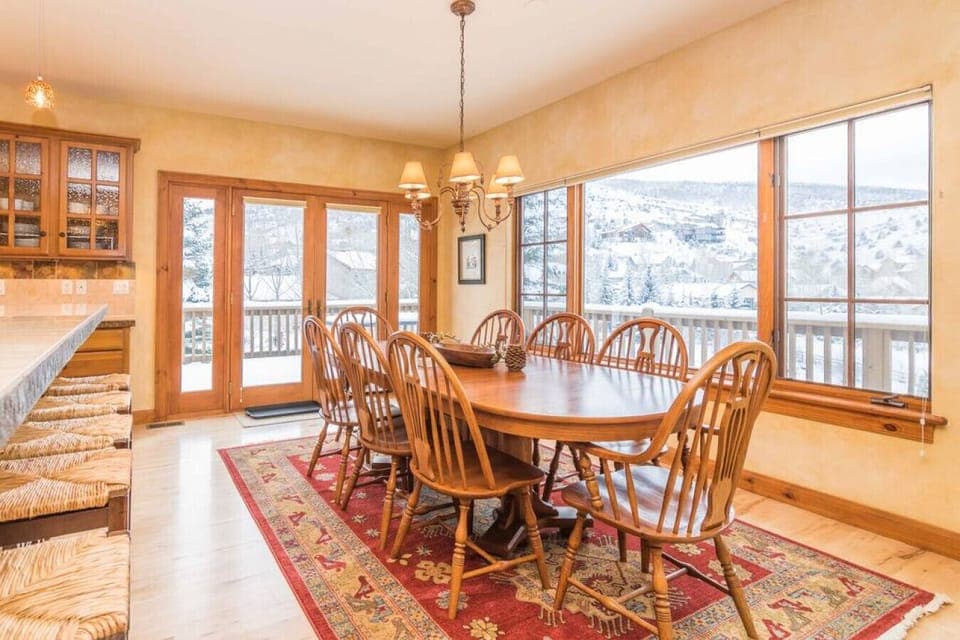 Kitchen dining table seats up to 8 with expansive alpine views