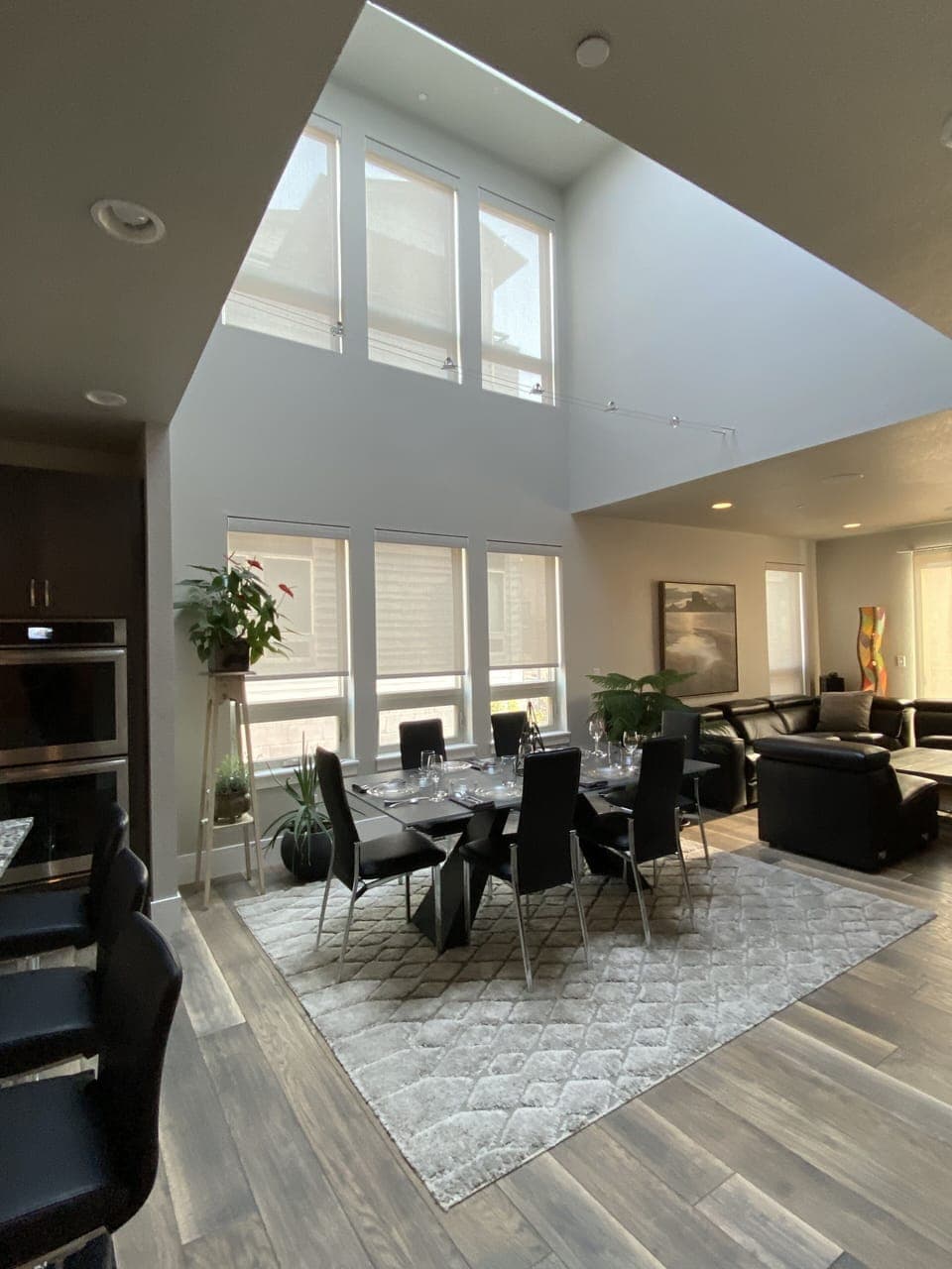 Dine in the atrium with table setting for 8.