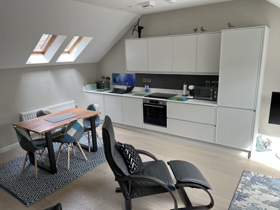 View from the living room to the dining/kitchen area.