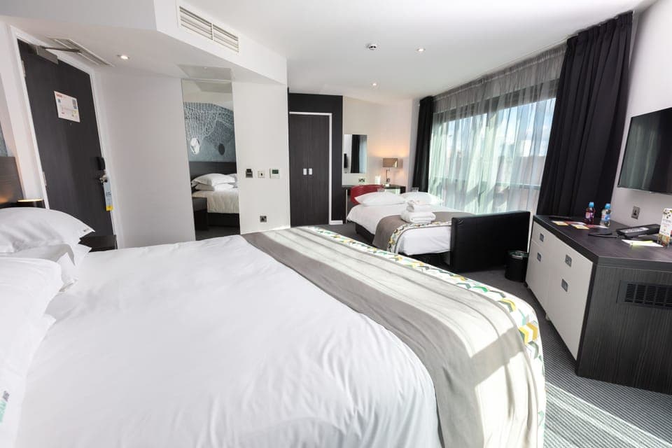 Room, 1 King Bed with Sofa bed (View) | Free minibar, in-room safe, desk, blackout drapes