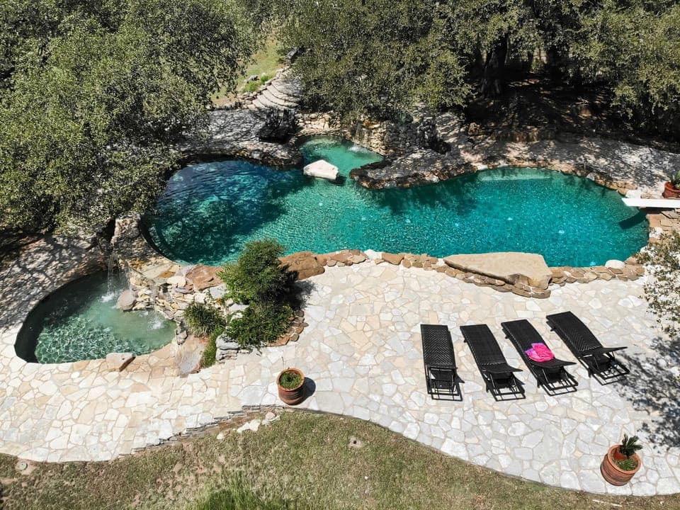 Absolutely amazing country club style 12' pool with a diving board and BBQ area