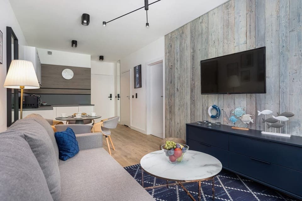 Living room with a comfortable sofa and TV. 