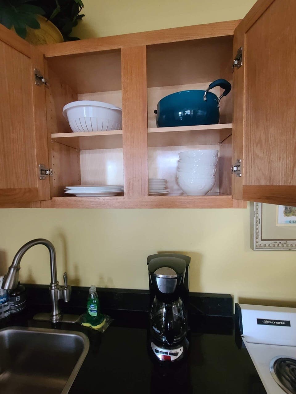 plates, bowls, mixing bowls, pots and pans, silverware, utensils