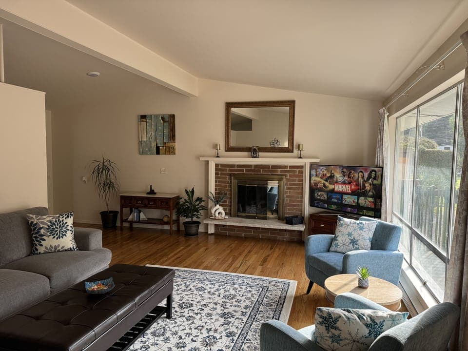 Spacious & bright living room with lots of comfortable places to relax.