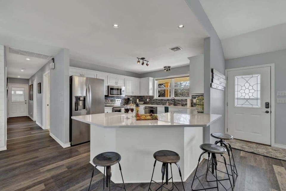 Full kitchen with bar seating for four.