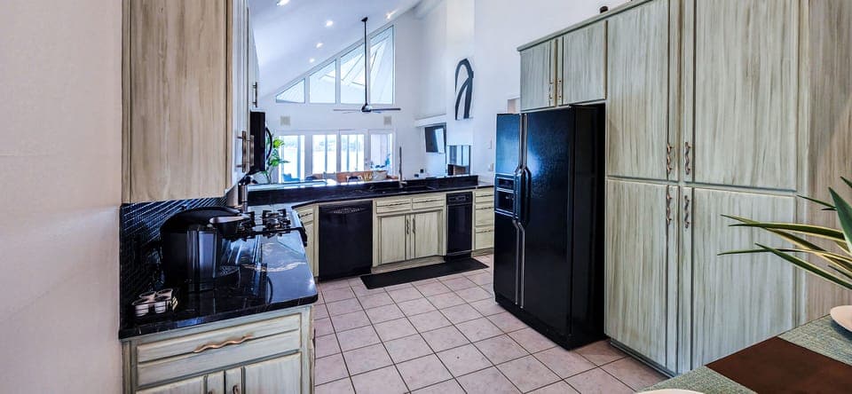 Fully stocked kitchen with essential appliances & flatware