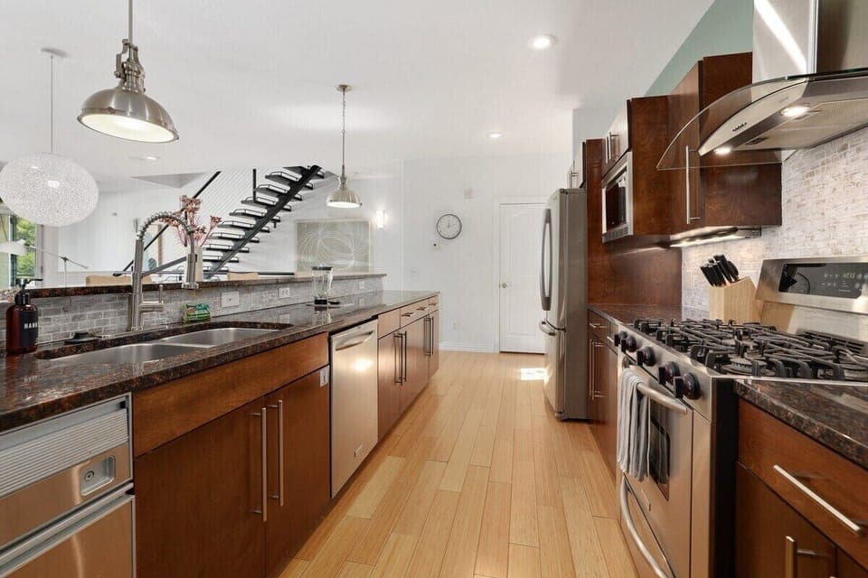 Walk up the stairs and you'll find yourself in our open-concept kitchen and living space.