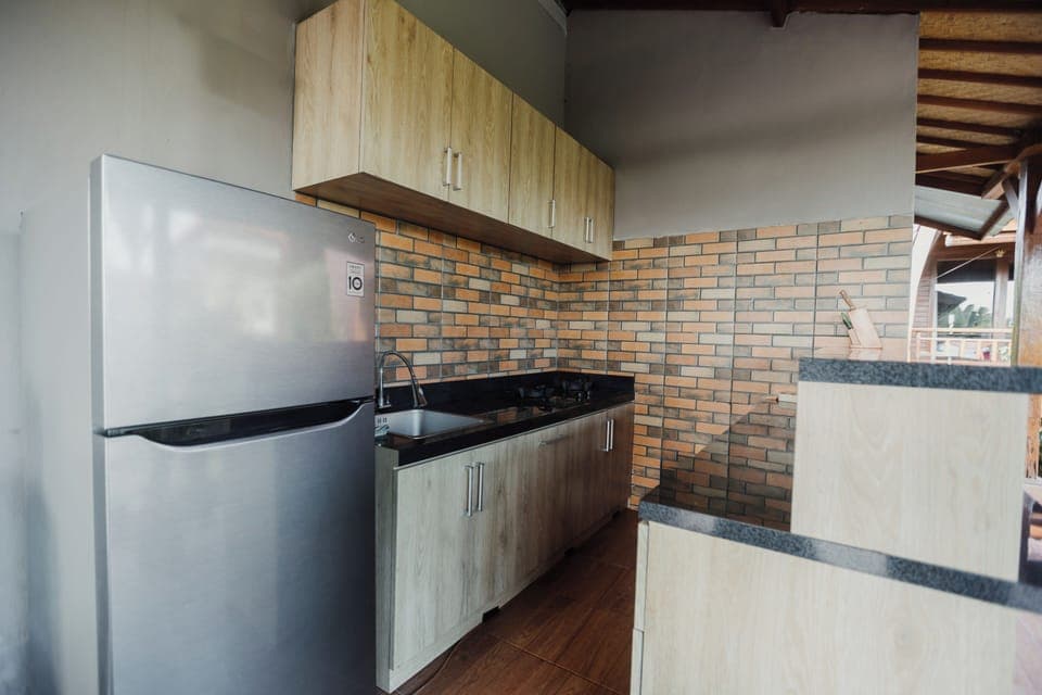 Deluxe Double Room, Pool View | Shared kitchen | Full-size fridge, microwave, cookware/dishes/utensils