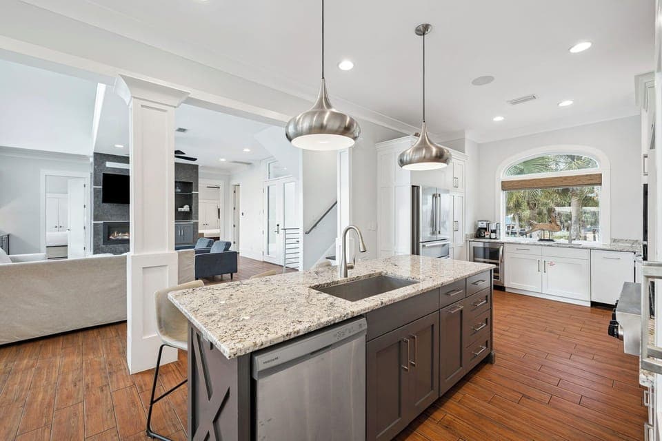 Your gourmet kitchen awaits with granite countertops, modern appliances, and elegant pendant lighting for memorable meal preparation.