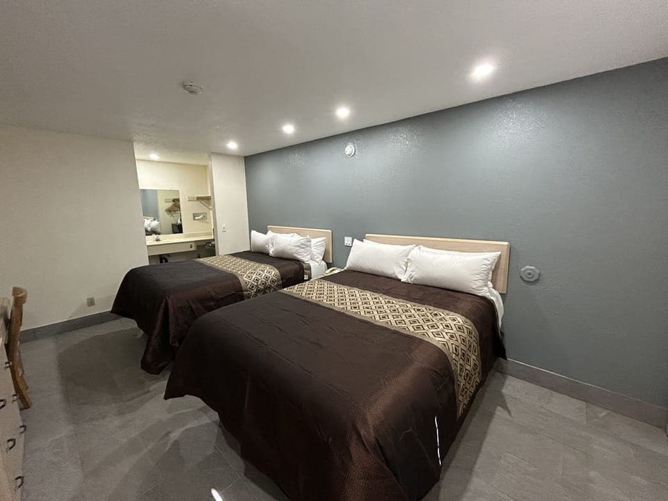 Standard Room, 2 Queen Beds, Non Smoking | Desk, iron/ironing board, cribs/infant beds, rollaway beds