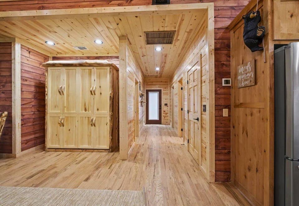 Corridor of cabin dreams! Each door opens to new memories waiting to be made.