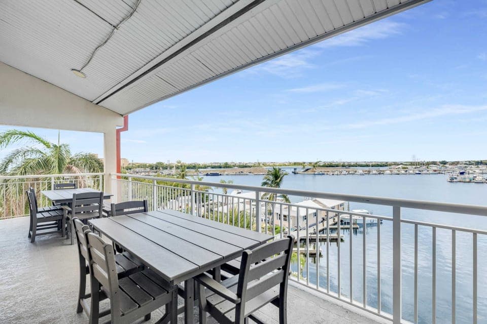 Oversized balcony for hanging out or eating outside with water views, Polywood furniture