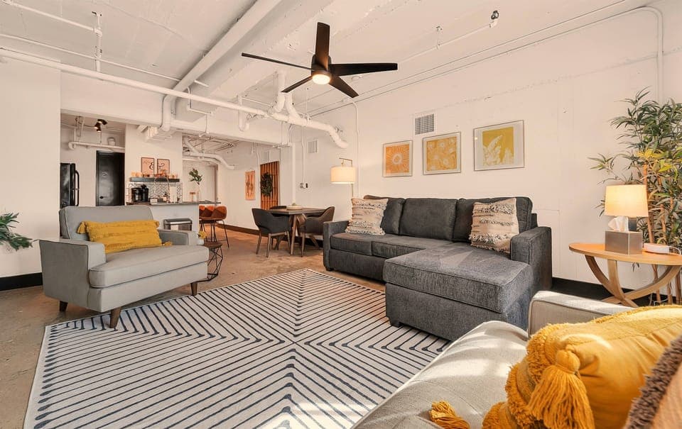 Cozy up close with your group on these comfy, oversized living room chairs and pull-out couch!