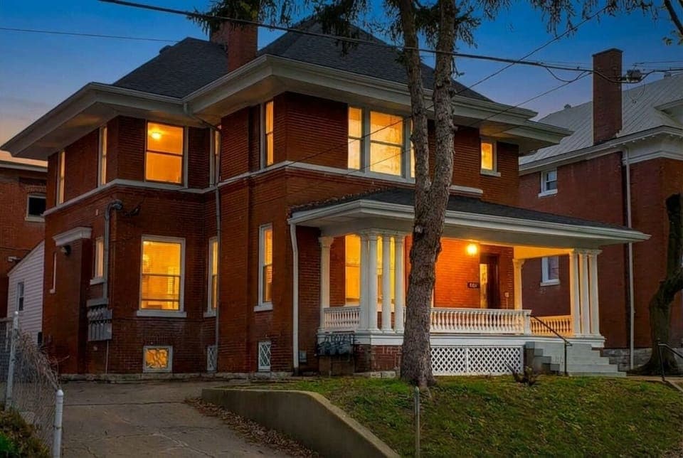 Welcome to your grand historic brick home glowing beautifully under the night sky. This spectacular and spacious property is fully ready to host your ultimate group getaway.