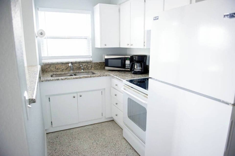 Unit 1- Kitchen is stocked with all the supplies you will need for a home cooked meal..dishes, pots and pans, utensils, glasses, mixing bowls and measuring supplies, Tupperware, a microwave, blender, coffee maker, and oven.  We even have tinfoil!