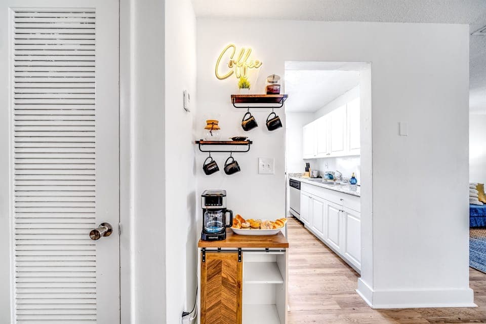 Nothing's cozier than a hot cup of coffee, right? At Palm Wave Stays, every unit comes with a coffee station for ultimate relaxation. Curl up with a book or your fave series & let your caffeine kick in. Book now! www.palmwavestays.com