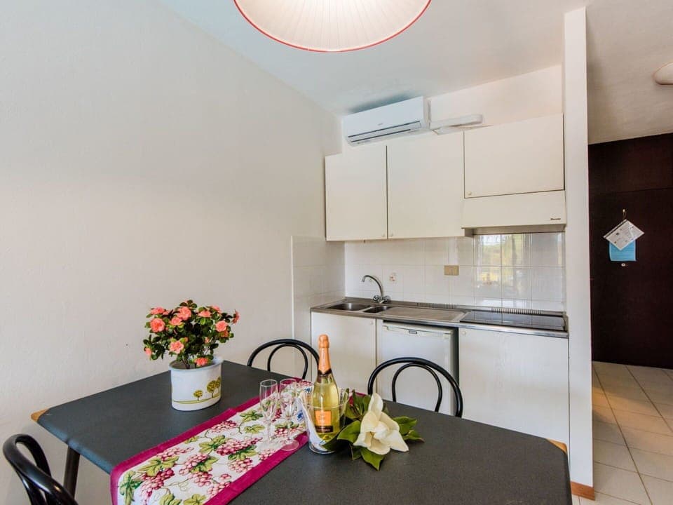 Cabinetry, Property, Furniture, Table, Countertop, Interior Design, Kitchen, Flower, Lighting, Sink