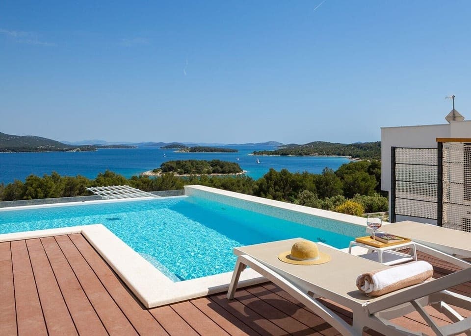 View of the sea and the islands from the terrace of the Luxury Villa Murter Exotic on Murter with heated pool and sun loungers