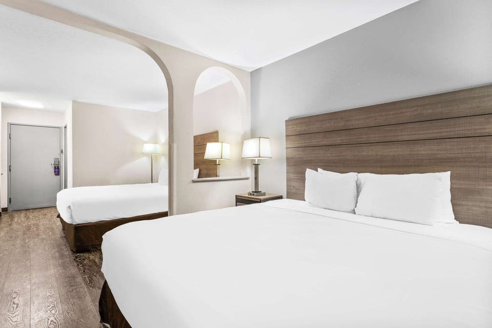 Room, Multiple Beds | Individually furnished, desk, laptop workspace, iron/ironing board