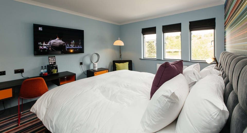 Club Room (FREE Gym & Pool Access) | Desk, laptop workspace, blackout drapes, iron/ironing board