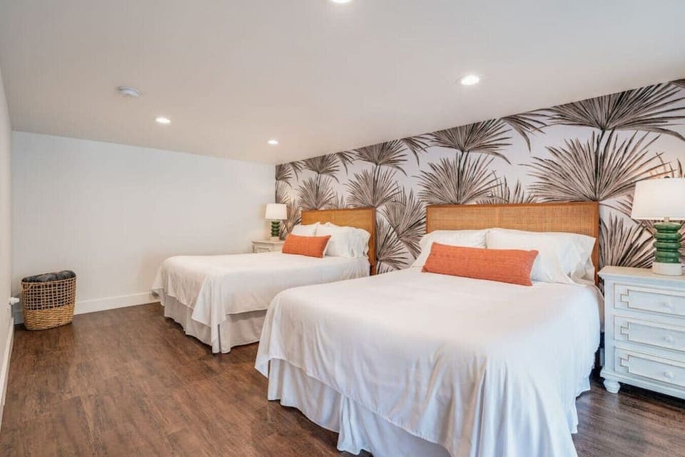 Two queen Helix beds with large side tables and plenty of storage.