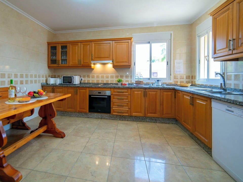 Kitchen, Furniture, Countertop, Cabinetry, Flooring, Kitchen Appliance, Interior Design, Floor, Wood, Major Appliance
