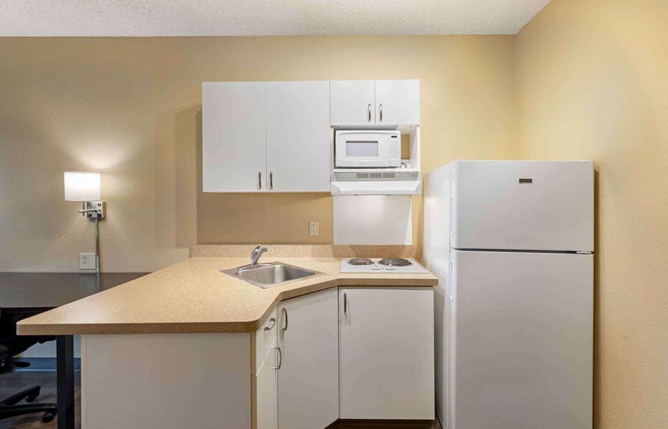 Fridge, microwave, stovetop, coffee/tea maker