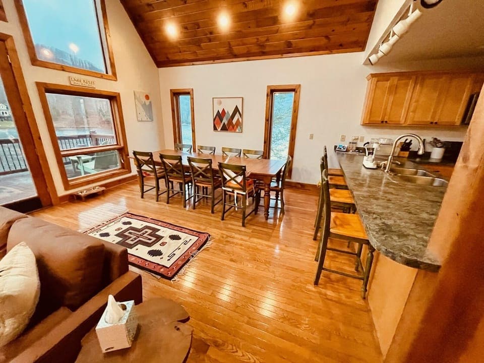 Open living area on the main floor with huge dining table for the whole family.