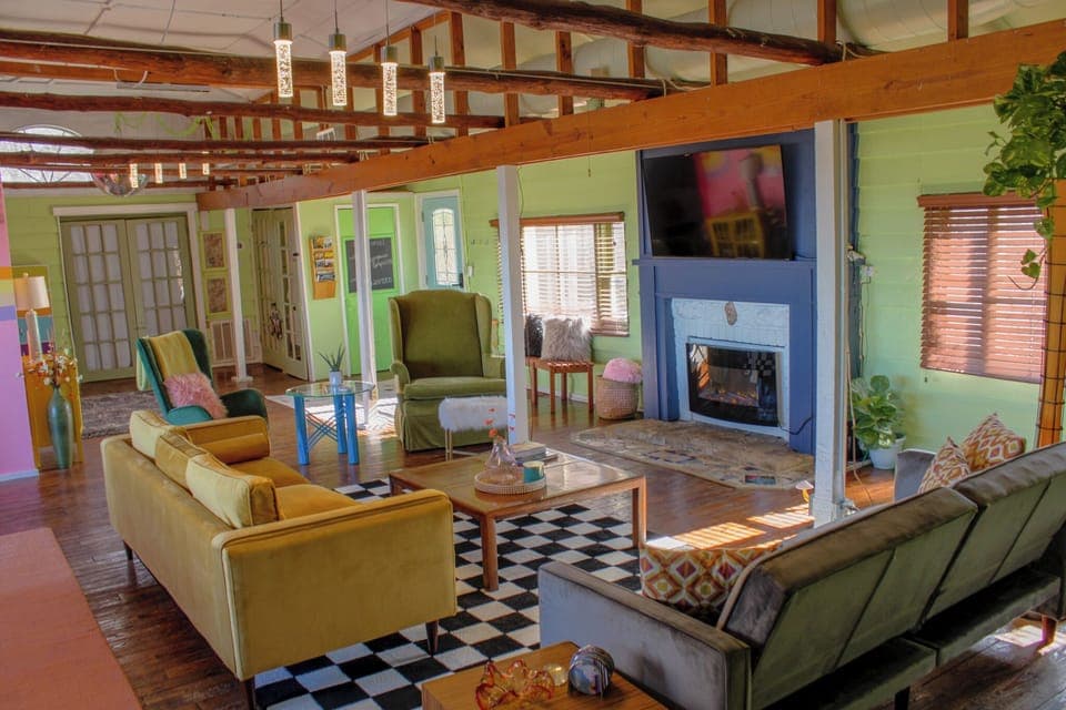 living room with pull out couch, skee ball, electric fire place, games, tv, VIEW