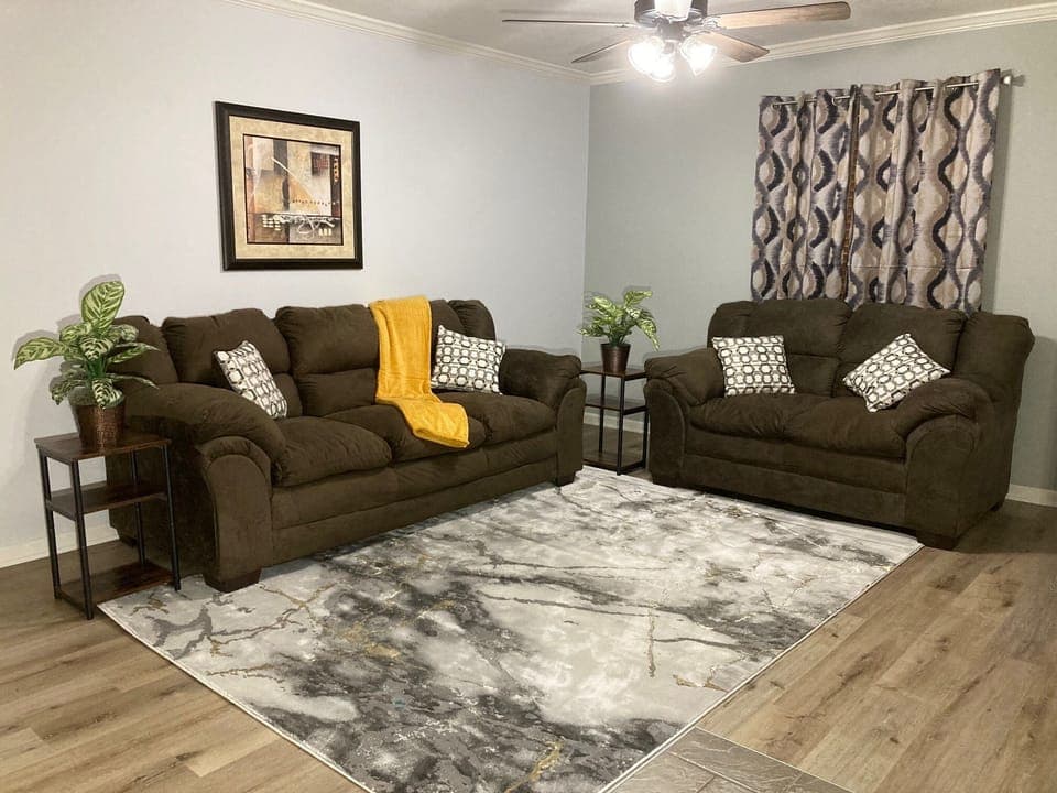 Kick back and relax in our living room complete with 55" TV and workstation.