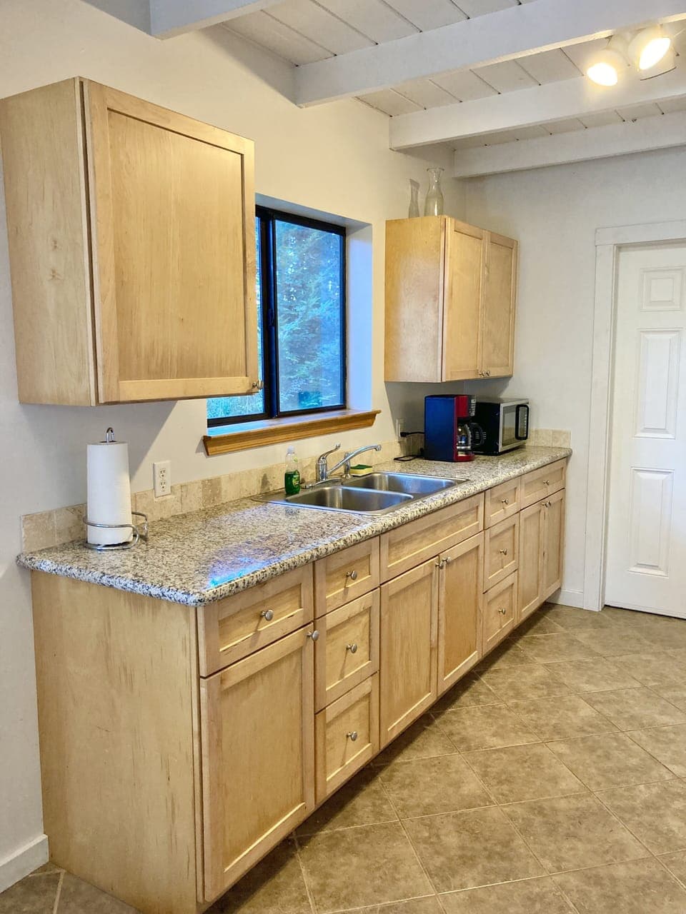 Kitchen with Coffee Maker, Microwave, Pot & Pans and Cooking Implements 